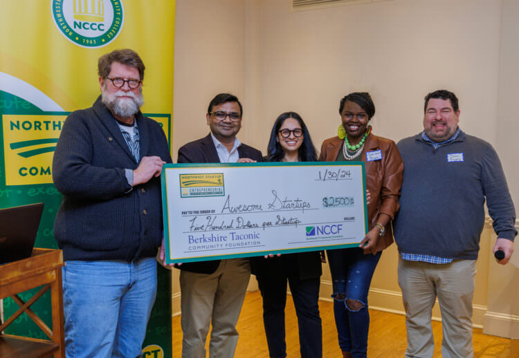 Entrepreneurs receive check at Northwest Community Startup Night with John Fiorello